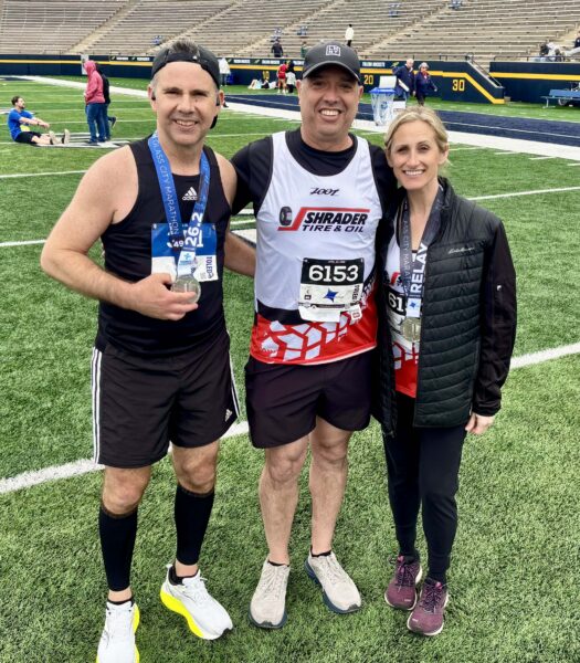 STO team celebrating after the 2026 Glass City Marathon corporate rela